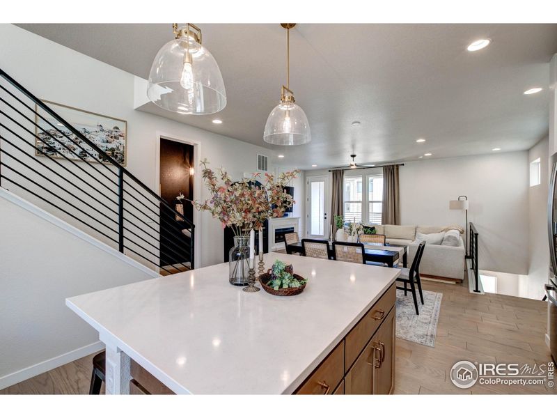 View from Kitchen through the Great Room. Loads of natural light from the large windows