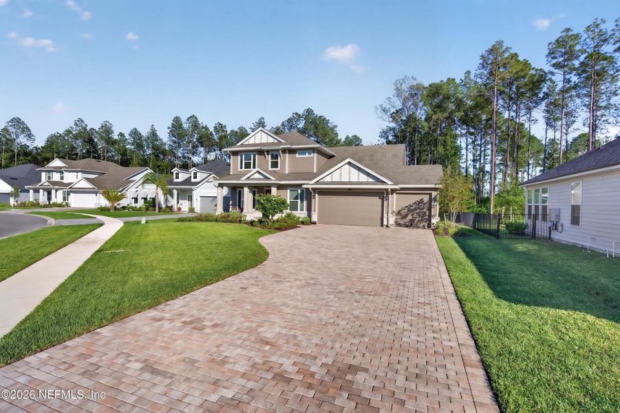 Front exterior of a new home in , St. Johns, FL, highlighting curb appeal (Image 27).