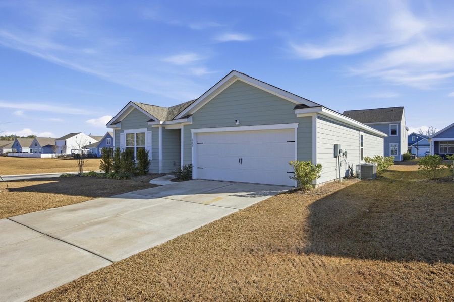Front exterior of a new home in Center Pointe, Santee, SC, highlighting curb appeal (Image 2). Front exterior of a new home in Center Pointe, Santee, SC, highlighting curb appeal (Image 2).