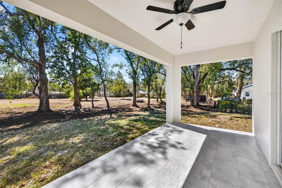 Exterior details and patio area of a home in , Dade City (Image 4).