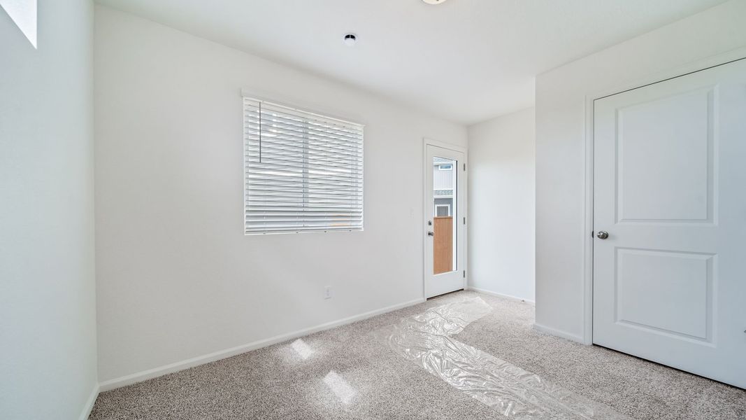 Spacious, unfurnished interior of a new home in Reunion, Commerce City (Image 18).