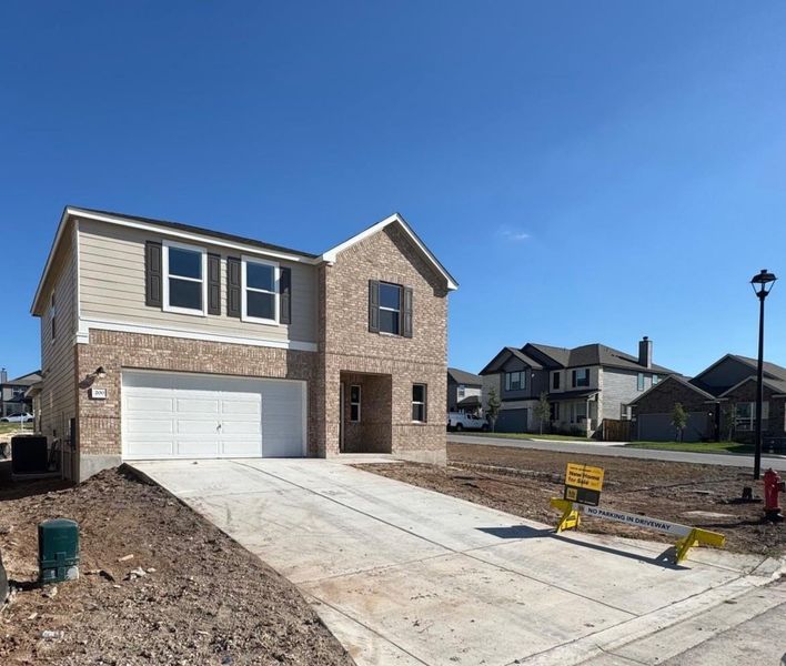 Front exterior of a new home in Sonterra - Cool Water, Jarrell, TX, highlighting curb appeal (Image 19).
