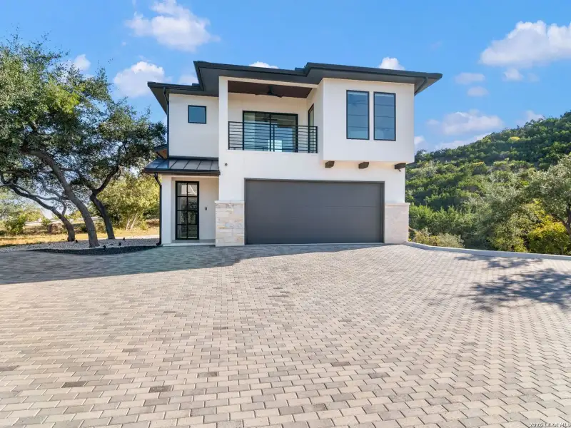 Front exterior of a new home in , San Antonio, TX, highlighting curb appeal (Image 2).