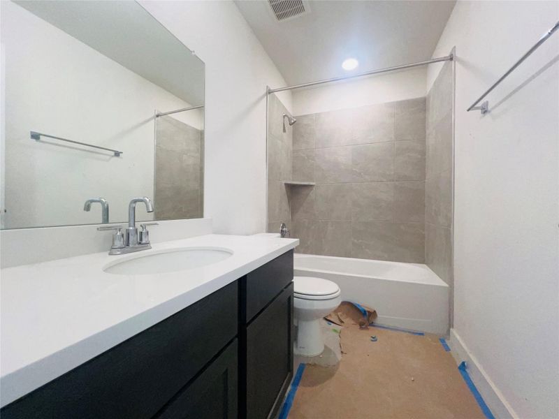 Full bath with tub / shower combination and vanity Full bath with tub / shower combination and vanity