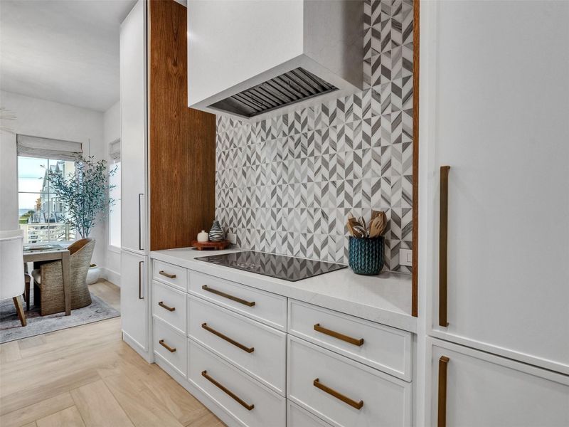 Culinary magic awaits in this stunning kitchen. The Monogram cooktop shines against sleek quartz counters, with soft-close drawers and abundant cabinetry keeping everything perfectly organized. From vibrant breakfasts to elegant sunset dinners, every meal is a joy. Living here feels effortless and inspired — a place where creativity, connection, and coastal serenity meet at the heart of your home. Culinary magic awaits in this stunning kitchen. The Monogram cooktop shines against sleek quartz counters, with soft-close drawers and abundant cabinetry keeping everything perfectly organized. From vibrant breakfasts to elegant sunset dinners, every meal is a joy. Living here feels effortless and inspired — a place where creativity, connection, and coastal serenity meet at the heart of your home.