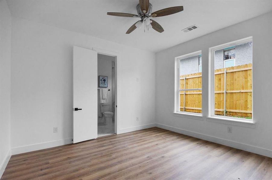 Empty room featuring ceiling fan and light wood-type flooring