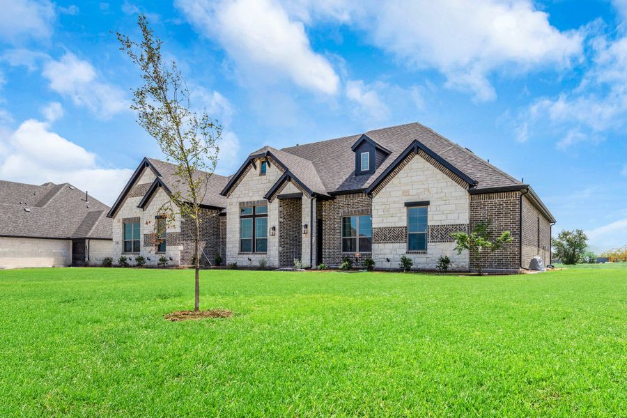 Front exterior of a new home in Heritage, Rockwall, TX, highlighting curb appeal (Image 24).