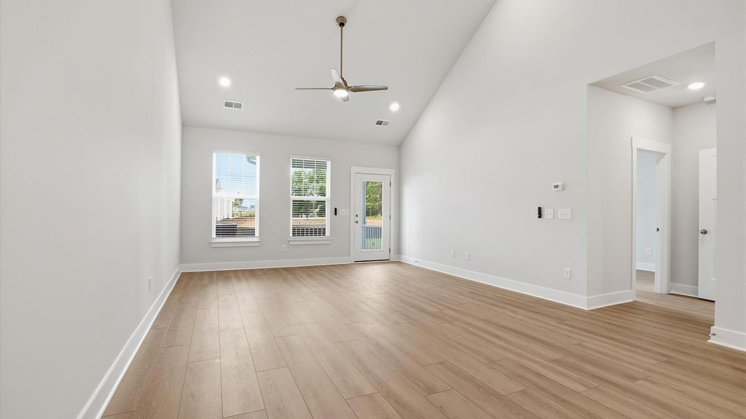Tasteful family room with two-story volume, refined finishes, and exceptional natural light located in Anderson, SC