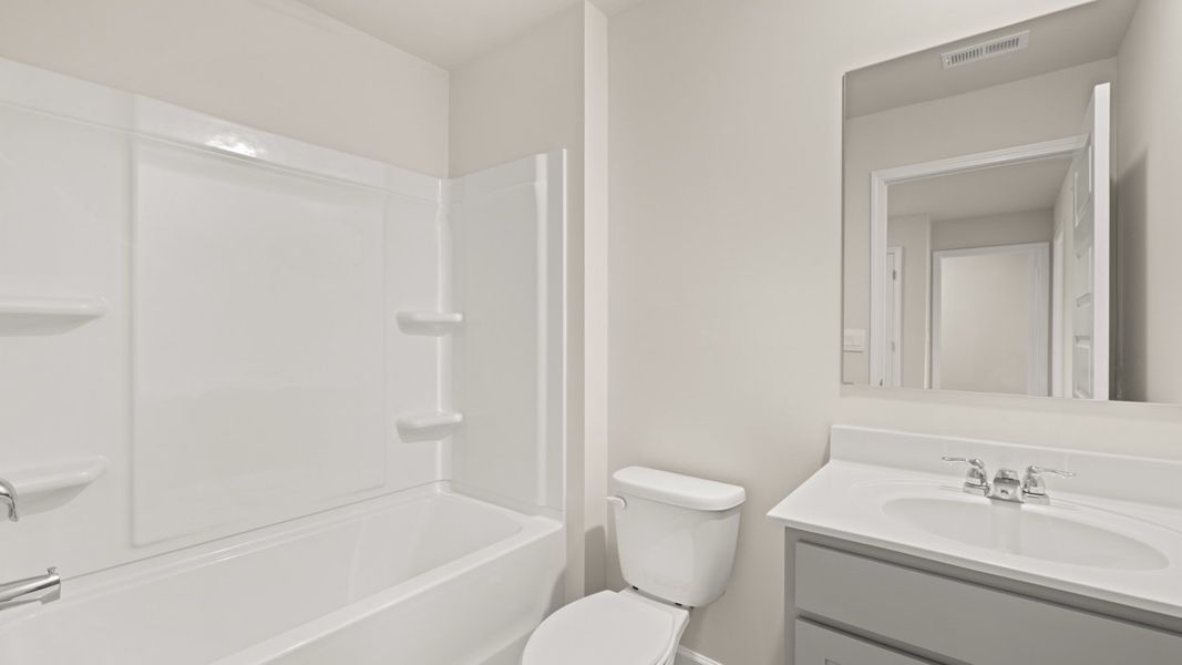 Representative furnished interior of a home built from the Salisbury by D.R. Horton in Echo Glen, Stockbridge (Image 27).