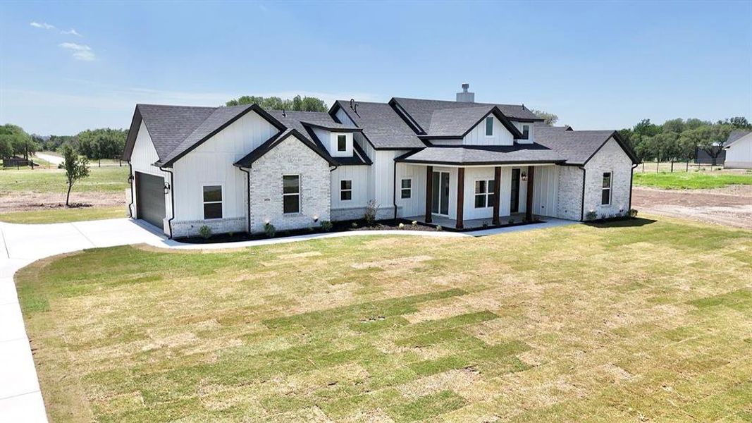 Front exterior of a new home in , Weatherford, TX, highlighting curb appeal (Image 26).