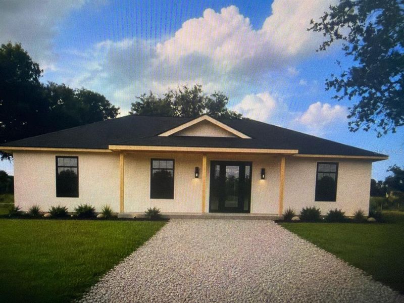 Front exterior of a new home in , Okeechobee, FL, highlighting curb appeal (Image 1). Front exterior of a new home in , Okeechobee, FL, highlighting curb appeal (Image 1).