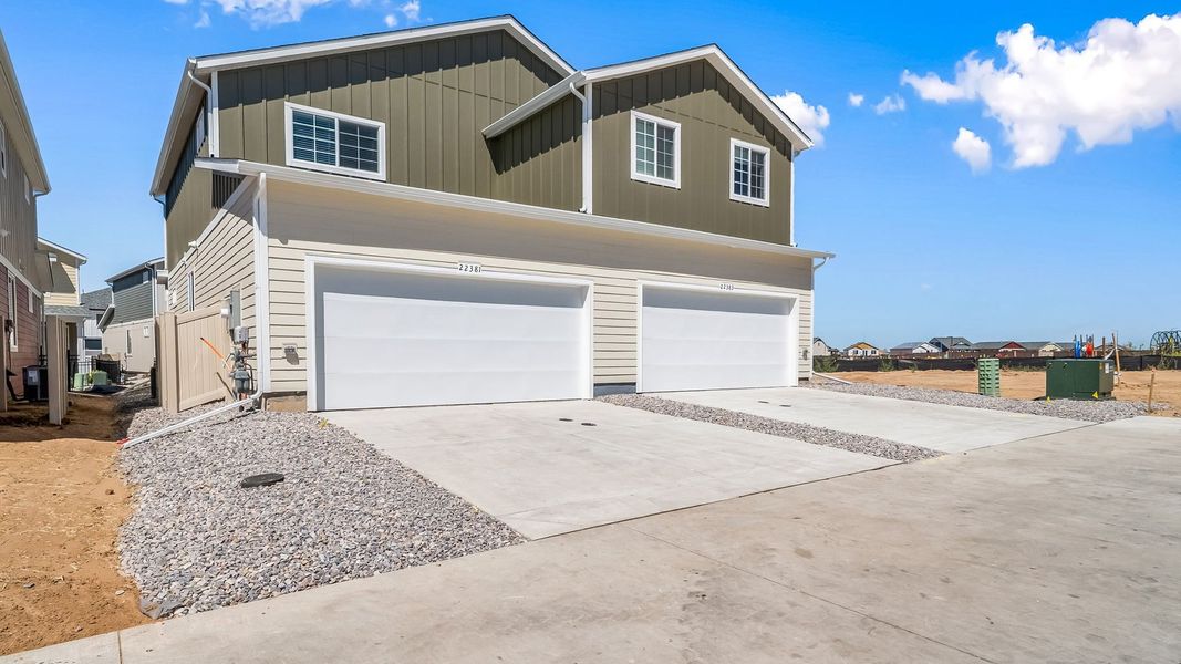 Front exterior of a new home in Green Valley Ranch, Aurora, CO, highlighting curb appeal (Image 20). Front exterior of a new home in Green Valley Ranch, Aurora, CO, highlighting curb appeal (Image 20).