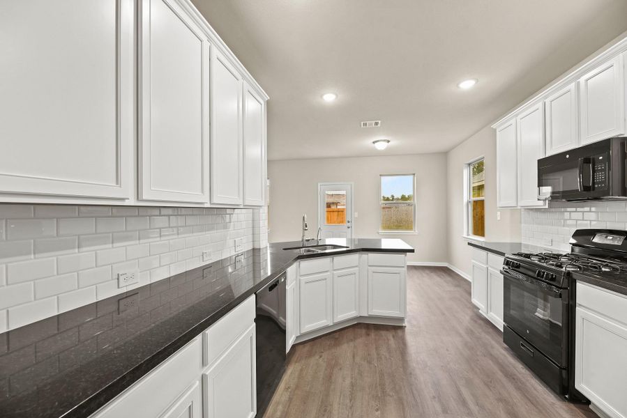 Stunning kitchen with tons of counter and cabinet space (*Photo not of actual home and used for illustration purposes only.)