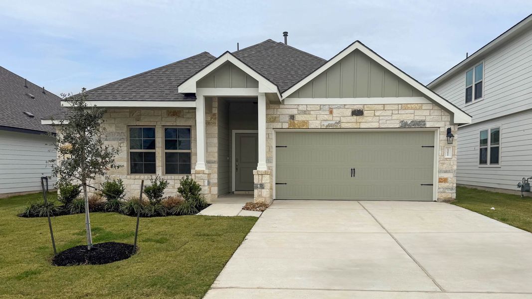 Front exterior of a new home in Southern Pointe, College Station, TX, highlighting curb appeal (Image 1).