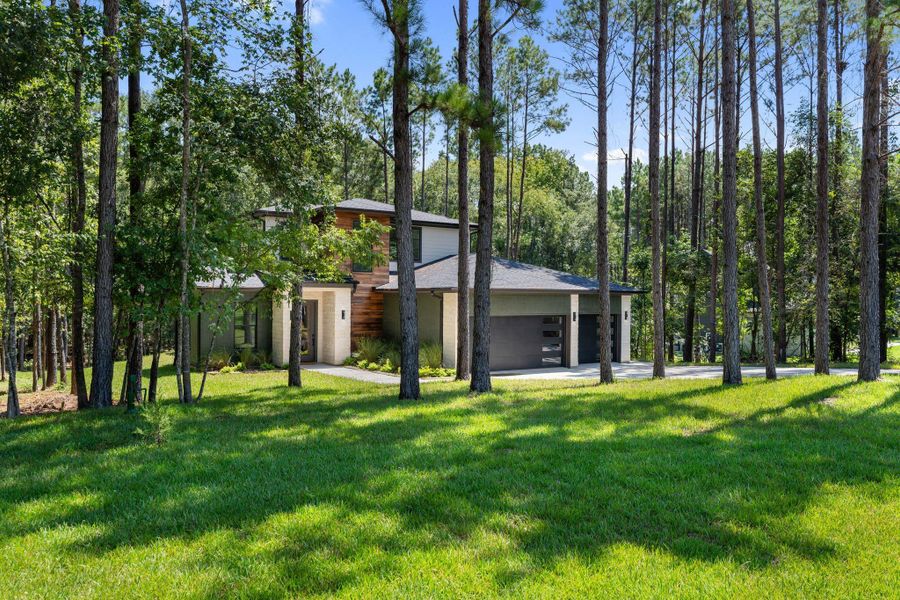 Front exterior of a new home in , Livingston, TX, highlighting curb appeal (Image 24).