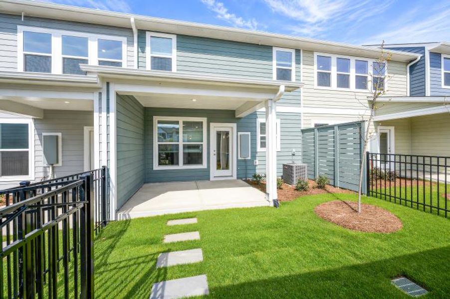 Exterior details and patio area of a home in North Creek Village - Townhomes, Huntersville (Image 3). Exterior details and patio area of a home in North Creek Village - Townhomes, Huntersville (Image 3).