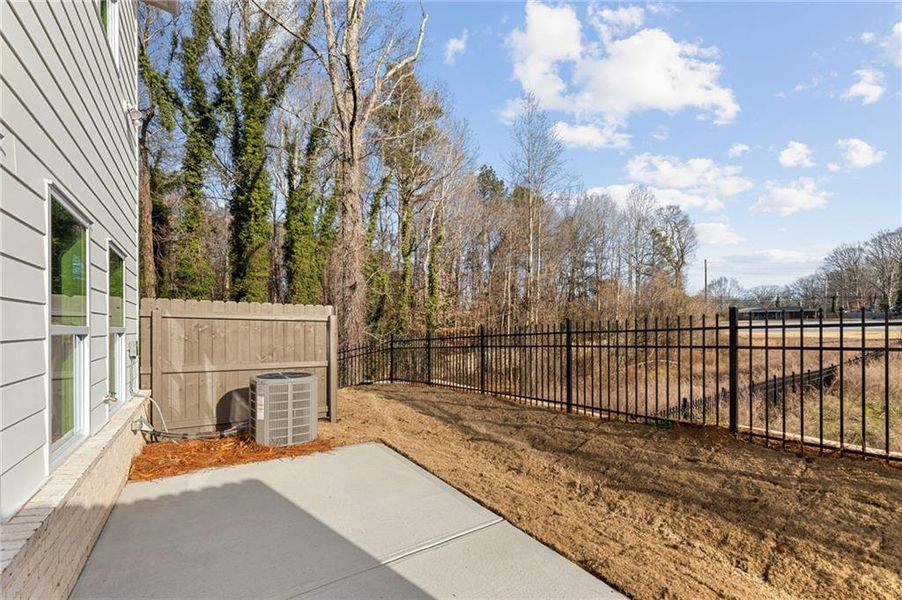 Exterior details and patio area of a home in River Walk Place, Lawrenceville (Image 3).