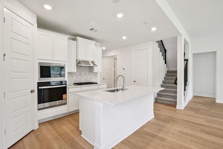 Furnished interior view inside a new home in Pine Lake Cove - Classic Series, Montgomery (Image 3).