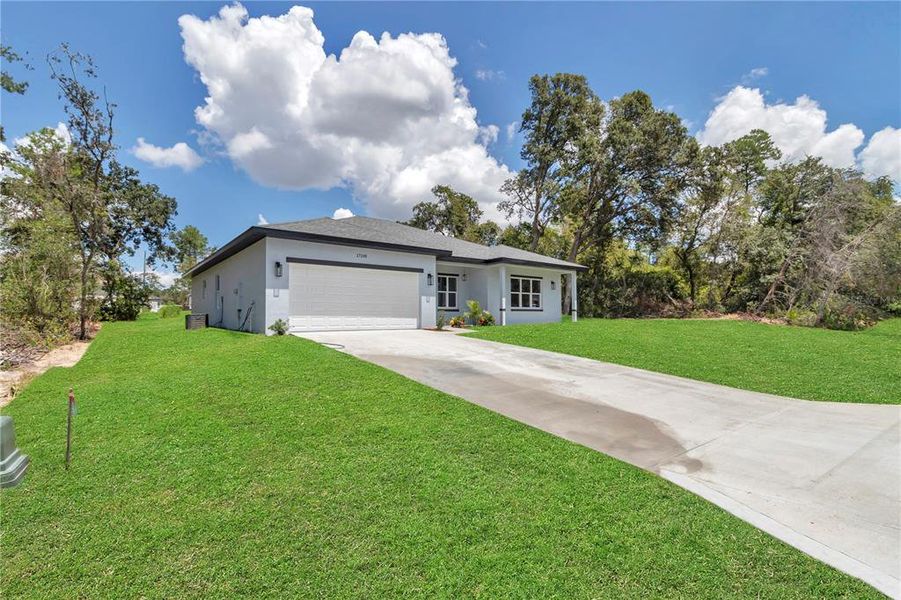 Front exterior of a new home in , Ocala, FL, highlighting curb appeal (Image 22).