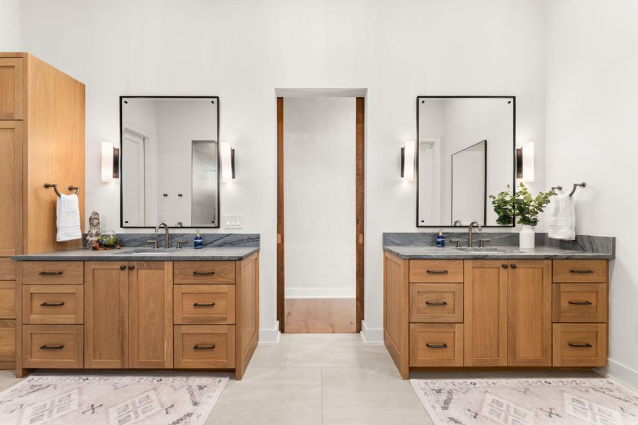 Bathroom featuring two vanities Bathroom featuring two vanities