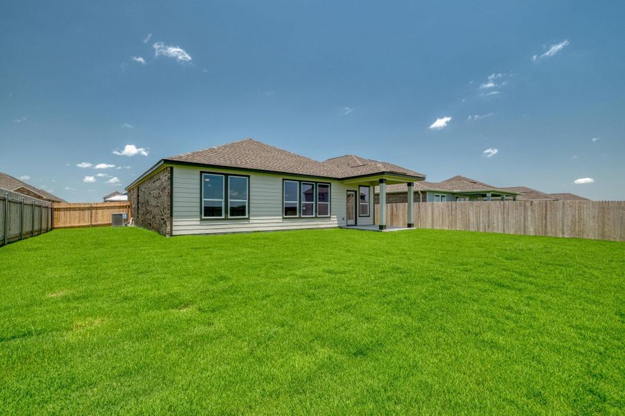 Exterior details and patio area of a home in Mustang Valley, Manor (Image 4).