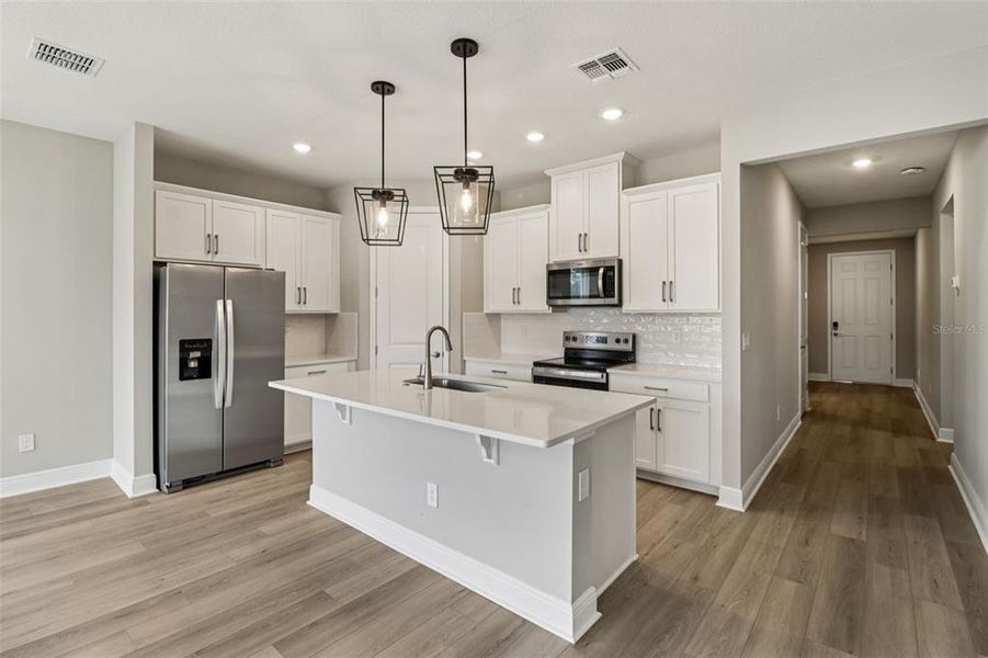 Furnished interior view inside a new home in Legends Preserve - Signature Series, Daytona Beach (Image 6).