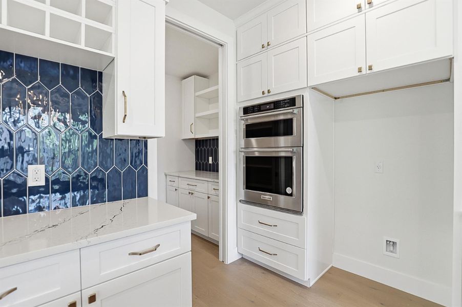 Wine storage, dry bar, pantry.