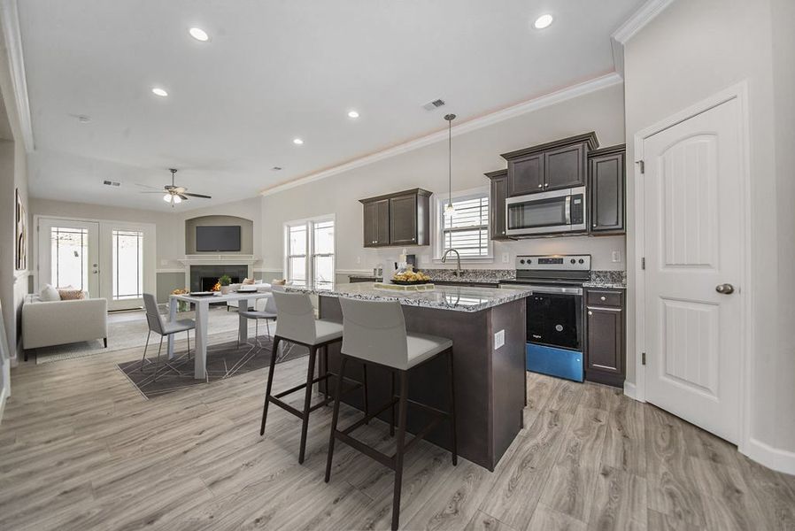 Representative furnished interior of a home built from the Quincy by Enchanted Homes in Lonesome Dove, San Antonio (Image 8).