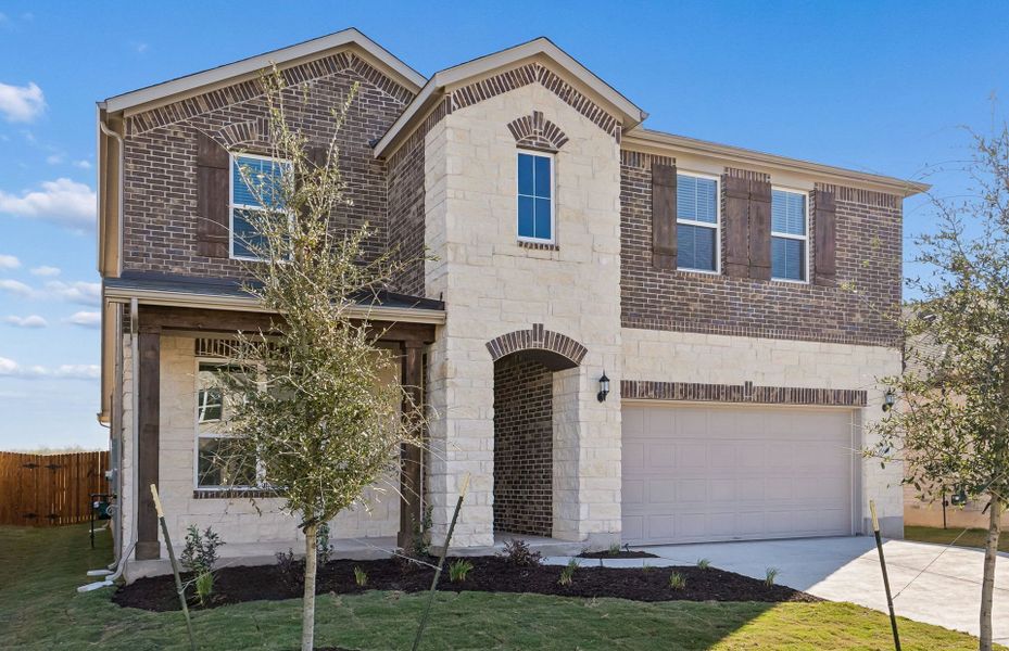 Front exterior of a new home in Lagos, Manor, TX, highlighting curb appeal (Image 22).