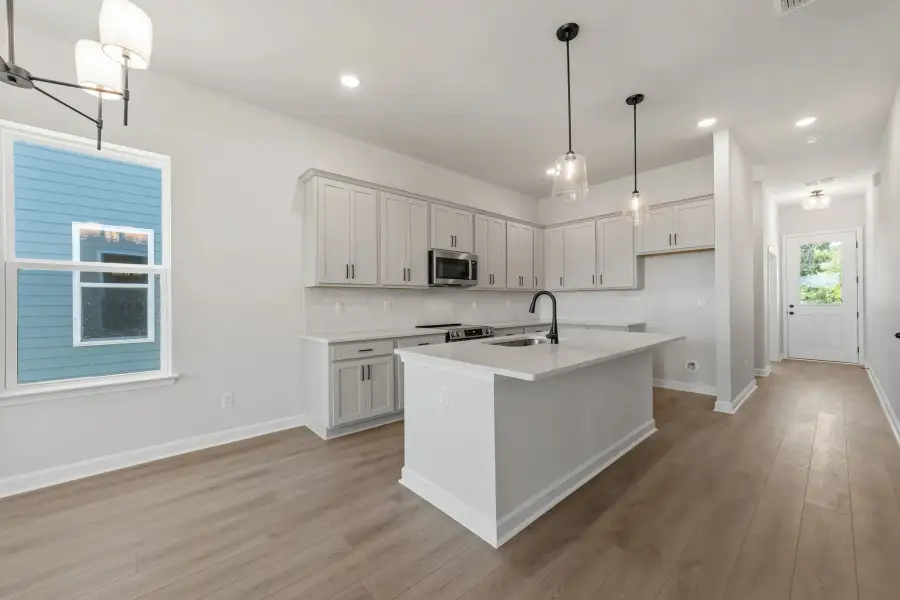 Sample Kitchen photo. Actual structural options and design finishes of home may vary.