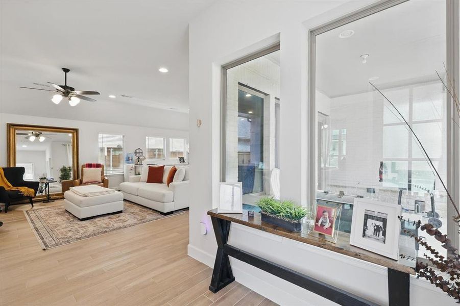 Living area featuring recessed lighting, wood finished floors, and ceiling fan