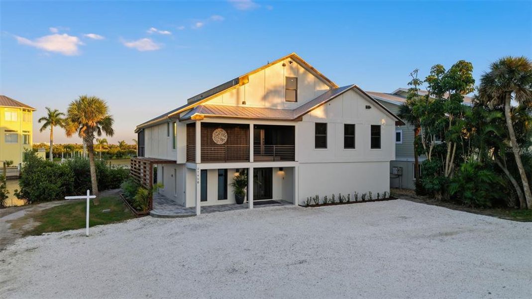 Front exterior of a new home in , Englewood, FL, highlighting curb appeal (Image 33).