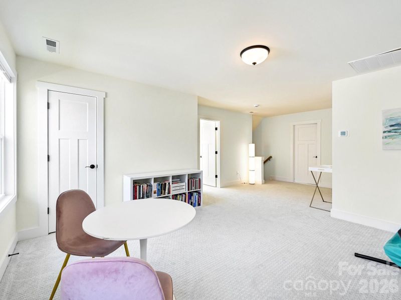 Upper level flex space with storage closet.