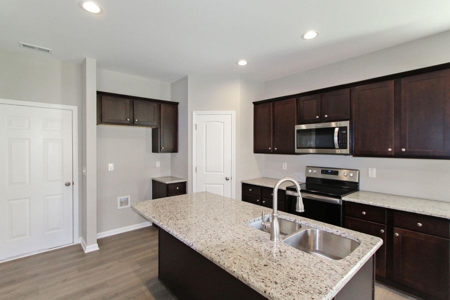 Representative furnished interior of a home built from the Nicklaus by RiverWILD Homes in Riverwood Ranch, Clayton (Image 8).