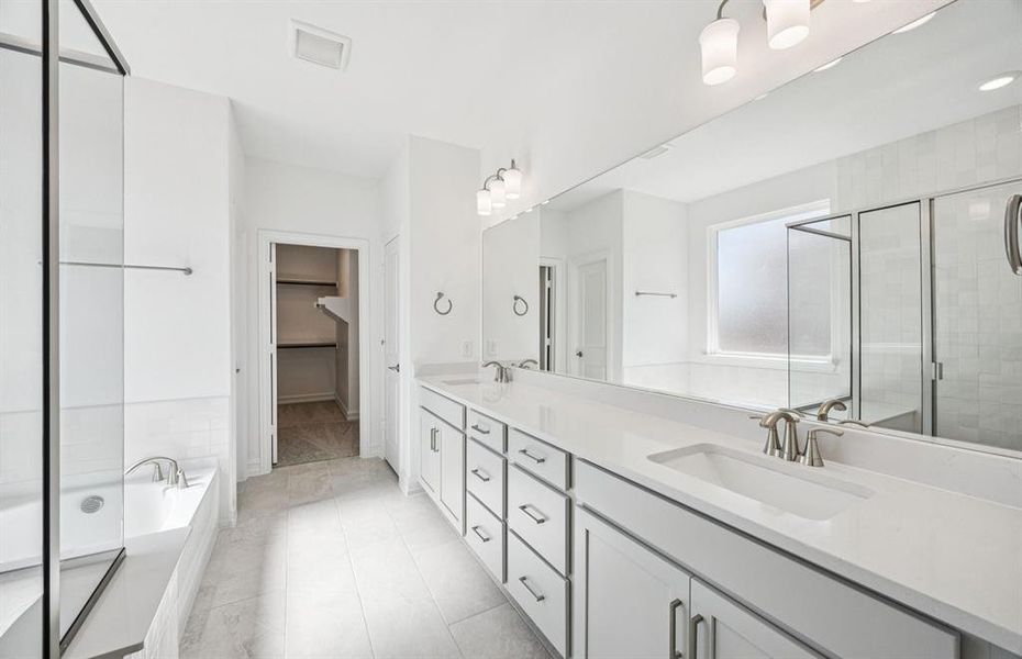 Spacious owner's bath with ample cabinet storage Spacious owner's bath with ample cabinet storage