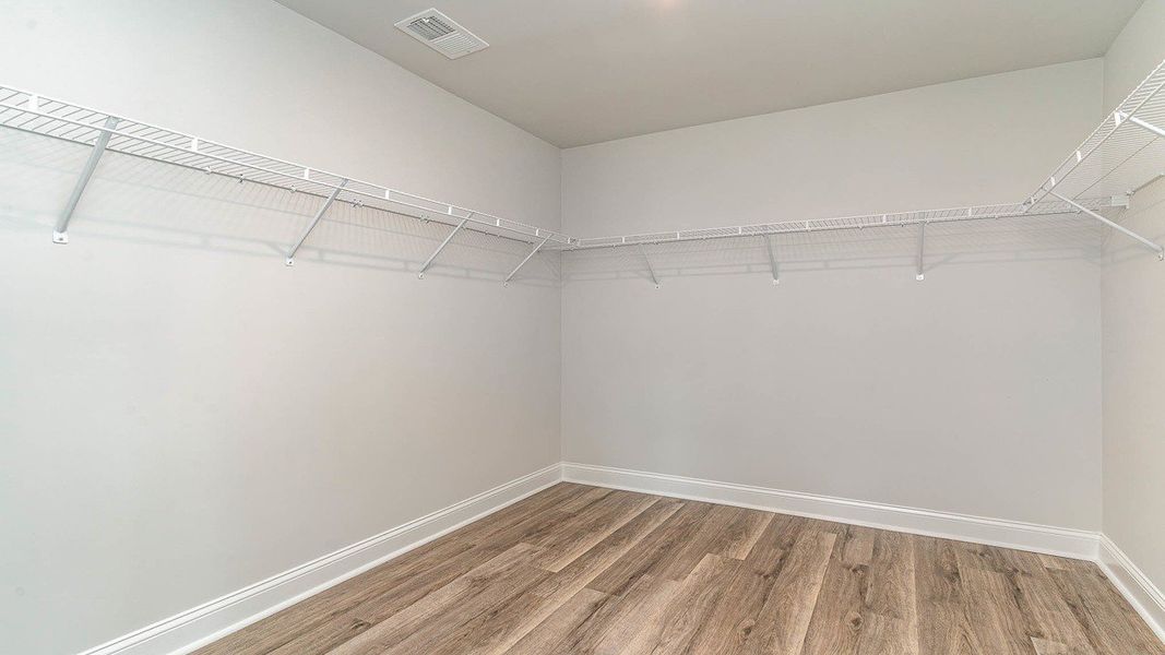 Representative unfurnished interior of a home built from the FORRESTER by D.R. Horton in Haven View, Murrells Inlet (Image 28).