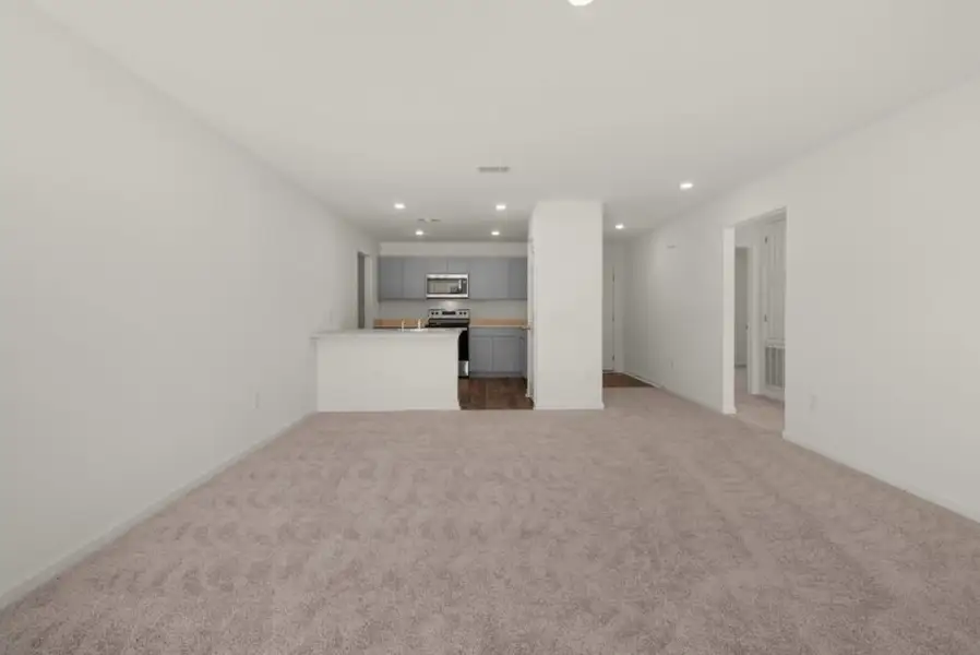 Representative unfurnished interior of a home built from the Maddox by Holiday Builders in Floridatown, Pace (Image 5).