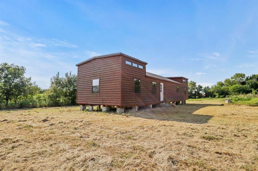 Front exterior of a new home in , Grand Saline, TX, highlighting curb appeal (Image 9).