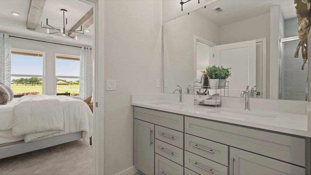 Primary Suite En Suite Bath with Dual Sinks by DRB Homes in Jacksonville, FL Primary Suite En Suite Bath with Dual Sinks by DRB Homes in Jacksonville, FL