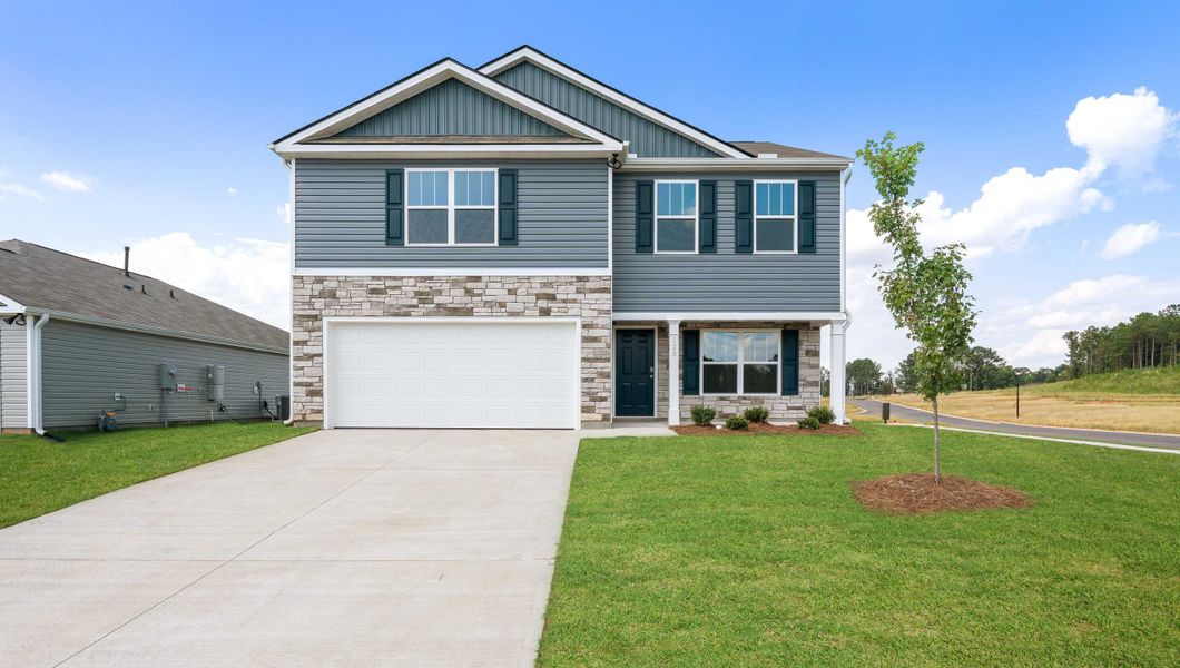 Front exterior of a new home in Cedar Gap, Fountain Inn, SC, highlighting curb appeal (Image 1). Front exterior of a new home in Cedar Gap, Fountain Inn, SC, highlighting curb appeal (Image 1).