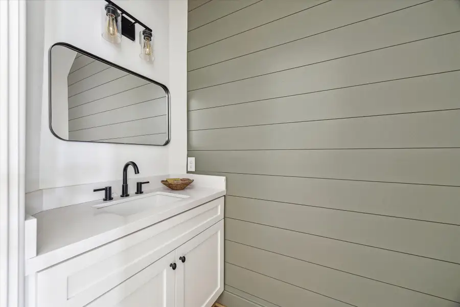 Half Bath with shiplap wall. Half Bath with shiplap wall.