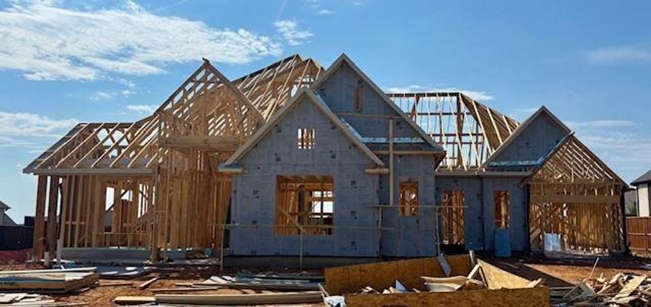 Front exterior of a new home in Canyon Falls 90s, Northlake, TX, highlighting curb appeal (Image 21).