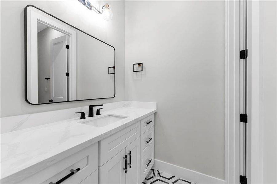 Convenient powder room located off front foyer