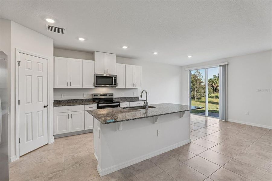 Furnished interior view inside a new home in Bradbury Creek - Signature Series, Haines City (Image 6).