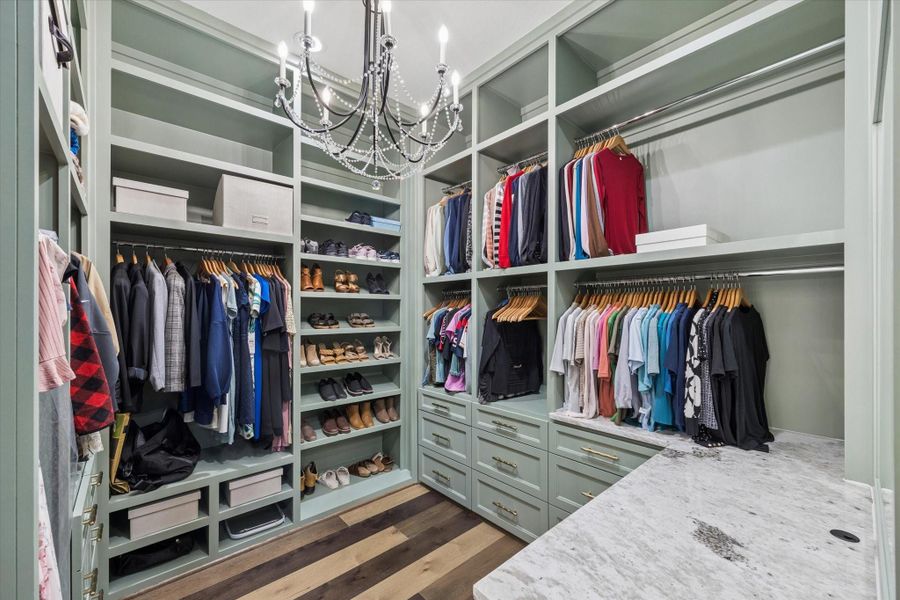 More than a closet, this boutique-inspired dressing room was designed for exceptional organization. Custom cabinetry, elegant display shelving, and Fantasy Zebra marble accents create a beautifully tailored space worthy of a luxury residence.