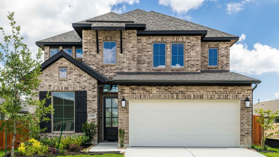Front exterior of a new home in Lariat 45', Liberty Hill, TX, highlighting curb appeal (Image 2). Front exterior of a new home in Lariat 45', Liberty Hill, TX, highlighting curb appeal (Image 2).