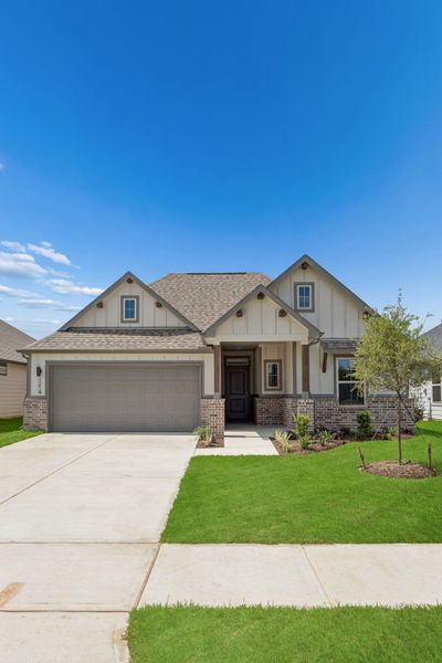 Front exterior of a new home in Riviera Pines, Huffman, TX, highlighting curb appeal (Image 21). Front exterior of a new home in Riviera Pines, Huffman, TX, highlighting curb appeal (Image 21).