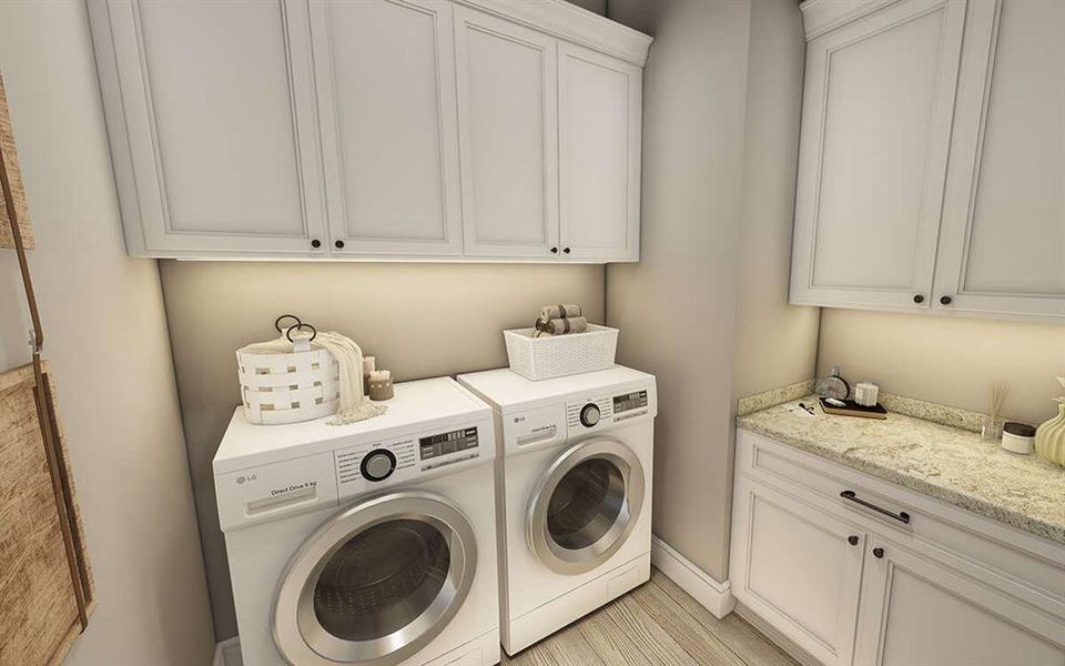 Handy counter space in a dedicated utility room with plenty of cabinet storage.