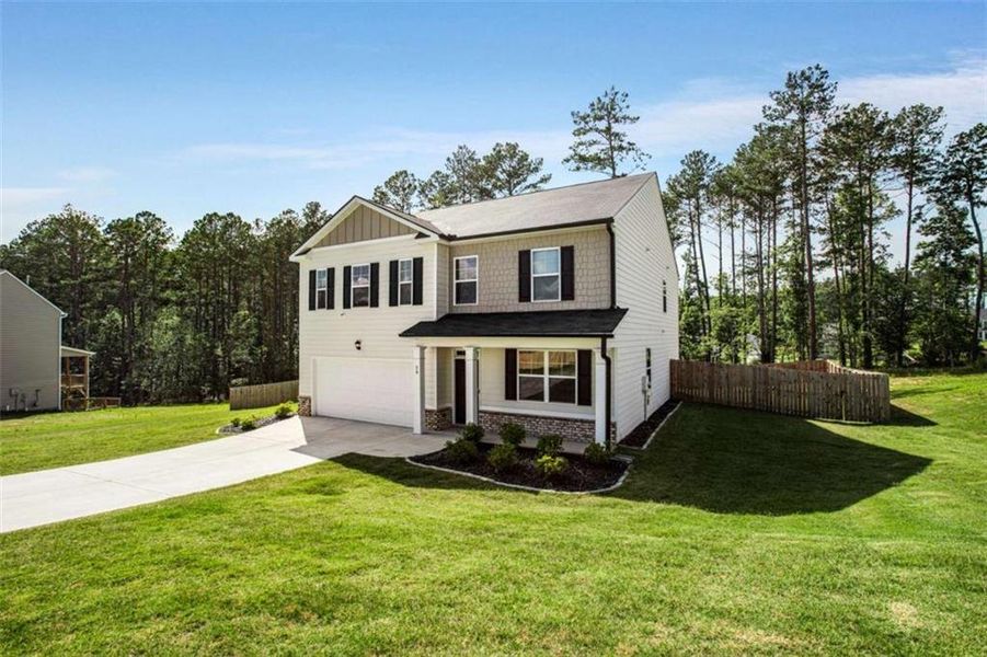 Front exterior of a new home in Stillwater Springs, Dacula, GA, highlighting curb appeal (Image 25). Front exterior of a new home in Stillwater Springs, Dacula, GA, highlighting curb appeal (Image 25).