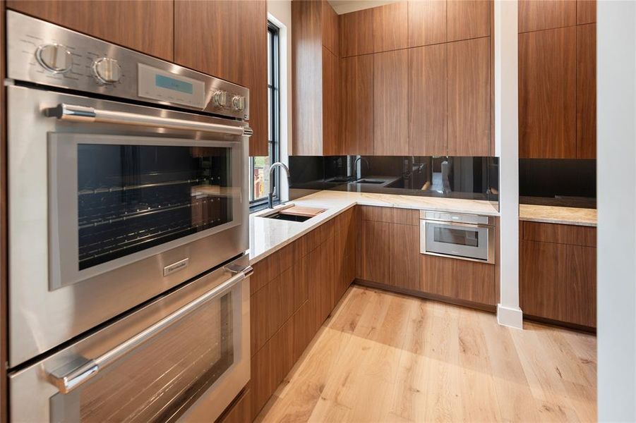 Butler Pantry with Double Ovens and plenty of prep space.